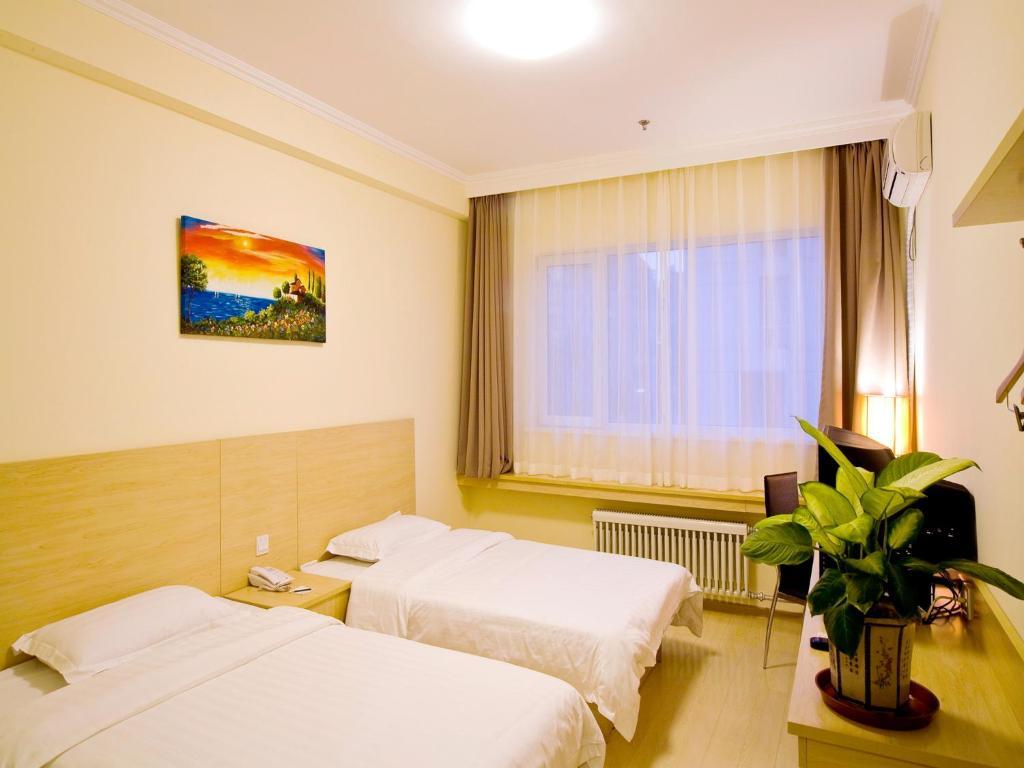 Haitian E Inn Qingdao Quarto foto
